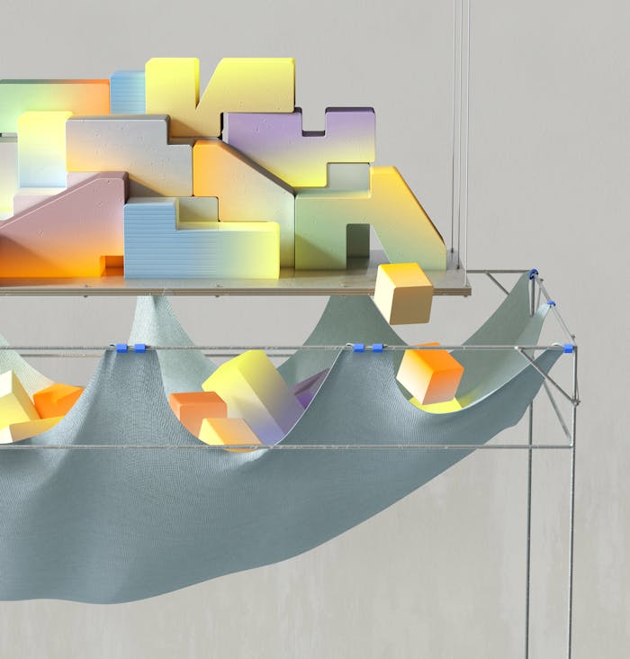 pexels-photo-17485631 Abstract 3D render of vibrant blocks on a suspended fabric structure, with soft lighting.
